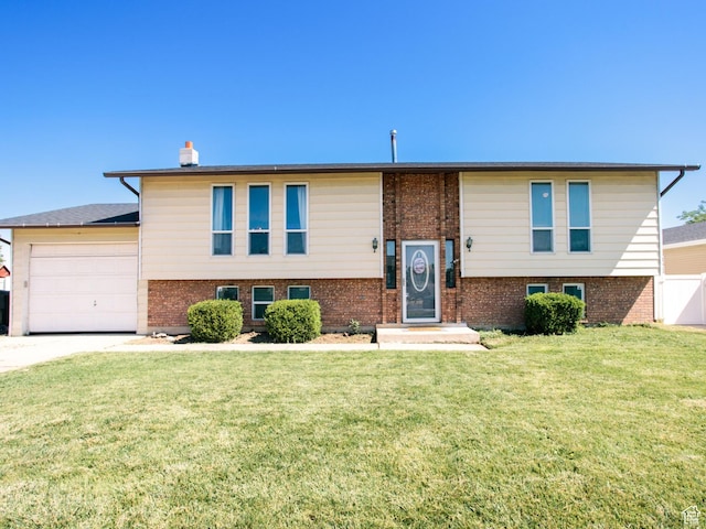 2080 W 2175 S, Syracuse, UT 84075 - raised ranch with a garage, brick siding, driveway, and a chimney
