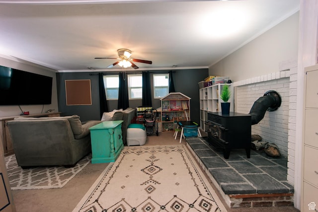 2080 W 2175 S, Syracuse, UT 84075 - living area featuring a wood stove, ceiling fan, and crown molding