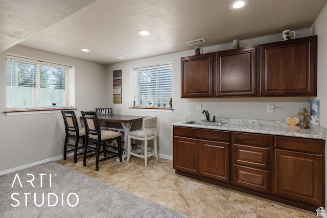 2185 N 250 W, Harrisville, UT 84414 - kitchen featuring healthy amount of natural light, dark brown cabinets, and recessed lighting