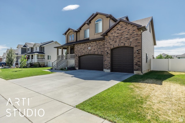 2185 N 250 W, Harrisville, UT 84414 - view of front of house with a garage, concrete driveway, brick siding, and a residential view
