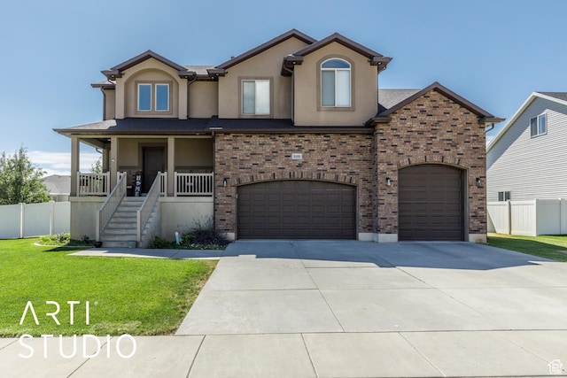 2185 N 250 W, Harrisville, UT 84414 - view of front of property featuring driveway, a garage, brick siding, and stucco siding