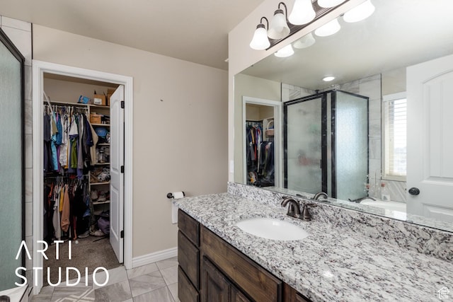2185 N 250 W, Harrisville, UT 84414 - bathroom featuring a walk in closet, vanity, and a stall shower