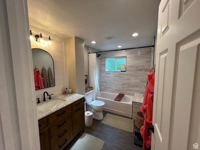 409 N 200 W, Brigham City, UT 84302 - full bathroom with vanity, wood finished floors, shower / bath combination with curtain, and recessed lighting