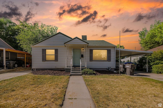 460 S 1074 E, Provo, UT 84606 - bungalow-style house with concrete driveway, an attached carport, and a front lawn