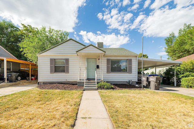 460 S 1074 E, Provo, UT 84606 - bungalow-style house featuring driveway, a front yard, a carport, and a chimney