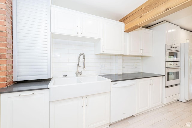 460 S 1074 E, Provo, UT 84606 - kitchen with white appliances, backsplash, dark countertops, and white cabinets