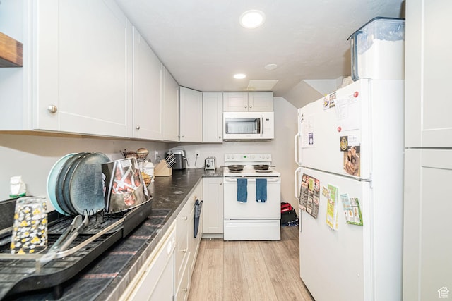 460 S 1074 E, Provo, UT 84606 - kitchen with white appliances, light wood finished floors, white cabinetry, dark countertops, and recessed lighting