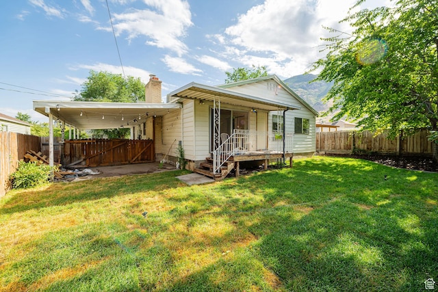 460 S 1074 E, Provo, UT 84606 - rear view of house with a fenced backyard and a chimney