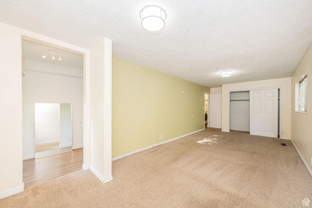 460 S 1074 E, Provo, UT 84606 - unfurnished bedroom with carpet flooring, a textured ceiling, and a closet