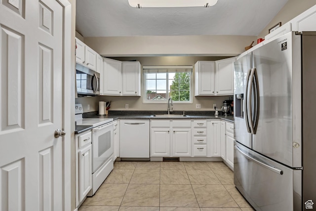 1492 N 1040 W, Orem, UT 84057 - kitchen featuring appliances with stainless steel finishes, dark countertops, white cabinetry, and light tile patterned flooring