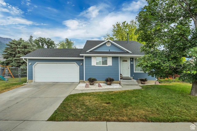 1492 N 1040 W, Orem, UT 84057 - view of front of house with an attached garage, driveway, and a shingled roof