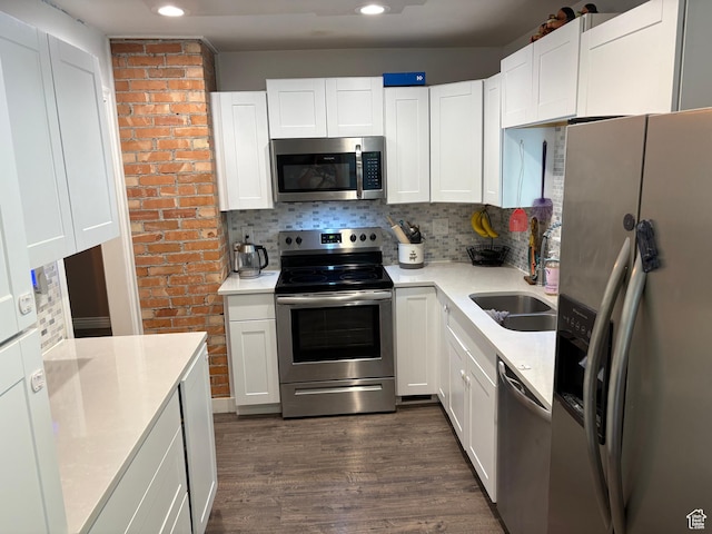 503 S Utah Ave, Provo, UT 84606 - kitchen with appliances with stainless steel finishes, dark wood finished floors, backsplash, light countertops, and recessed lighting