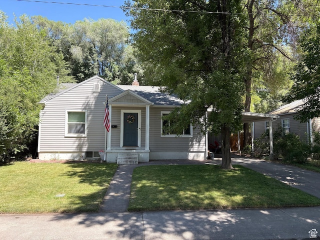 503 S Utah Ave, Provo, UT 84606 - bungalow-style home with concrete driveway, an attached carport, and a front lawn