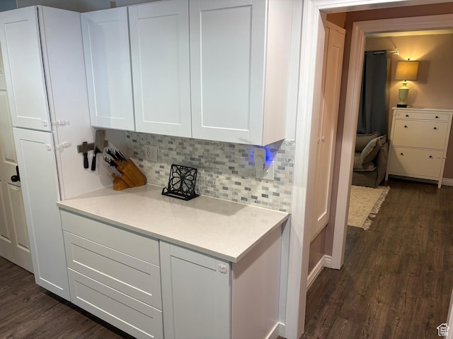 503 S Utah Ave, Provo, UT 84606 - kitchen with dark wood-style flooring, light countertops, backsplash, and white cabinetry