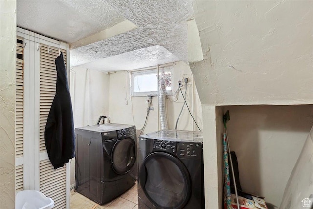 3221 Porter Ave, Ogden, UT 84403 - laundry area featuring a textured ceiling, light tile patterned floors, and independent washer and dryer