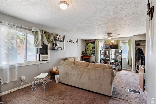 3221 Porter Ave, Ogden, UT 84403 - living area featuring carpet floors, a textured ceiling, a ceiling fan, and cooling unit