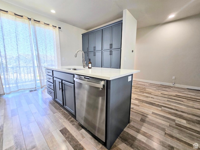 5149 W Arley Ct, Herriman, UT 84096 - kitchen with dishwasher, light wood-style floors, light countertops, a center island with sink, and recessed lighting