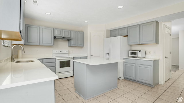 1238 S 1420 W, Woods Cross, UT 84087 - kitchen featuring white appliances, gray cabinets, light tile patterned flooring, a kitchen island, and light countertops