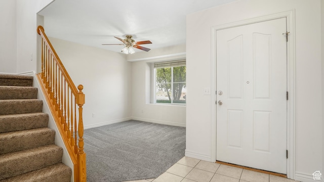 1238 S 1420 W, Woods Cross, UT 84087 - foyer with ceiling fan, stairway, light colored carpet, and light tile patterned floors