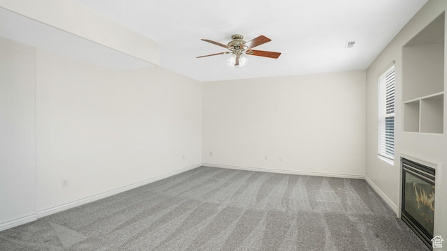 1238 S 1420 W, Woods Cross, UT 84087 - empty room featuring carpet, ceiling fan, and a glass covered fireplace