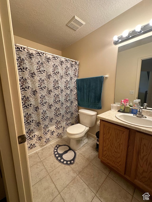 5551 W Geronimo Way S, West Jordan, UT 84081 - bathroom with vanity, tile patterned flooring, curtained shower, and a textured ceiling