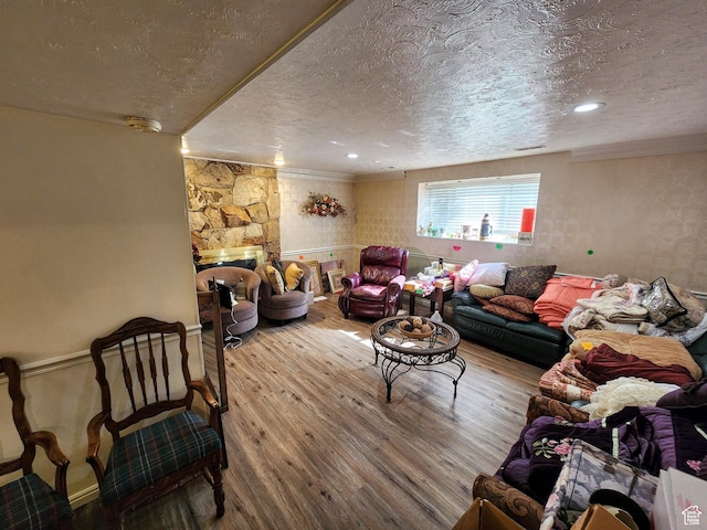 8857 S Capella Way E, Sandy, UT 84093 - living area with a textured ceiling, wood finished floors, ornamental molding, and a stone fireplace