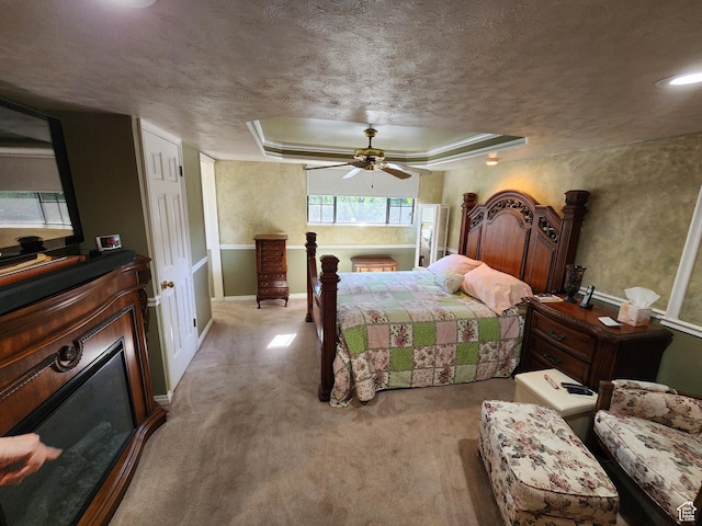 8857 S Capella Way E, Sandy, UT 84093 - bedroom with a raised ceiling, a textured ceiling, light carpet, and ceiling fan