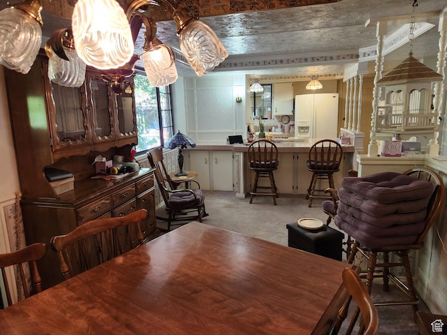 8857 S Capella Way E, Sandy, UT 84093 - dining area featuring light carpet and a chandelier