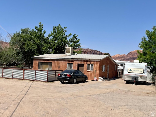 221 E 200 N, Moab, UT 84532 - view of front facade featuring brick siding and a mountain view