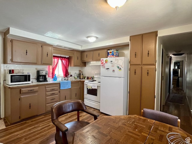 221 E 200 N, Moab, UT 84532 - kitchen with white appliances, under cabinet range hood, light countertops, and dark wood-type flooring