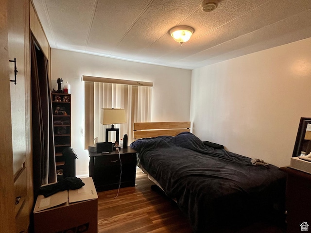 221 E 200 N, Moab, UT 84532 - bedroom featuring wood finished floors and a textured ceiling