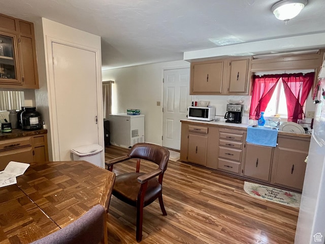 221 E 200 N, Moab, UT 84532 - kitchen featuring white microwave, wood finished floors, and refrigerator