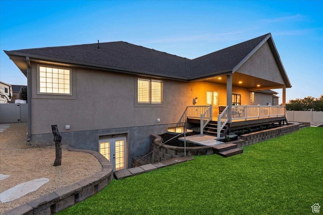 12469 S Patriot Hill Way, Herriman, UT 84096 - back of house featuring french doors, a wooden deck, stucco siding, and a shingled roof