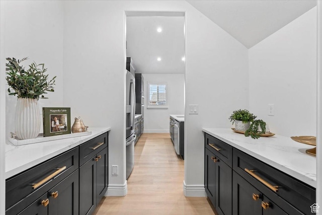 12469 S Patriot Hill Way, Herriman, UT 84096 - laundry area with light wood-style floors and baseboards
