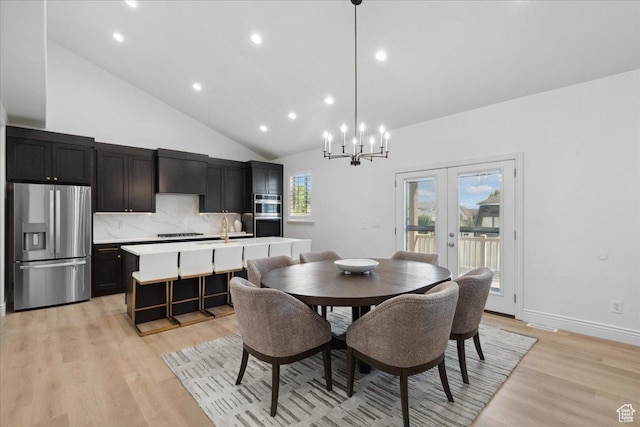 12469 S Patriot Hill Way, Herriman, UT 84096 - dining space featuring a chandelier, light wood-style flooring, recessed lighting, and high vaulted ceiling