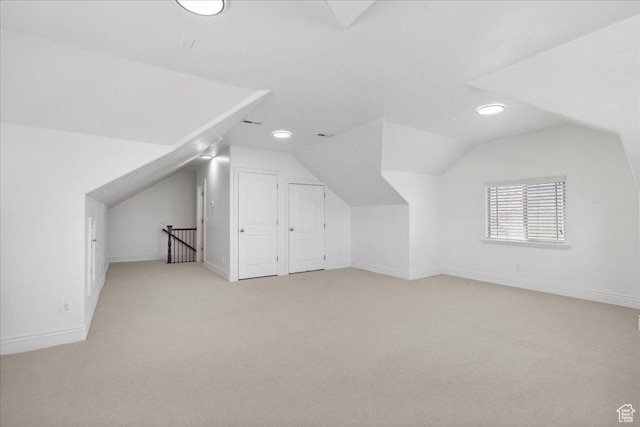 12469 S Patriot Hill Way, Herriman, UT 84096 - additional living space featuring light carpet and vaulted ceiling