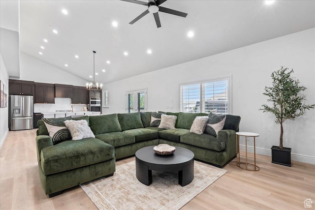 12469 S Patriot Hill Way, Herriman, UT 84096 - living room featuring high vaulted ceiling, recessed lighting, light wood-style flooring, ceiling fan, and a chandelier