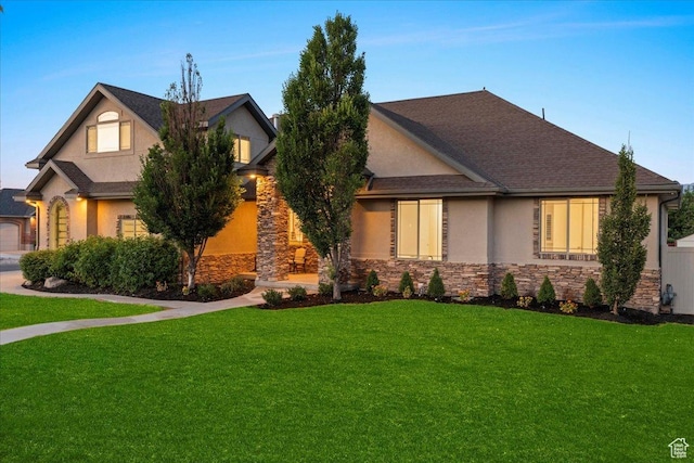 12469 S Patriot Hill Way, Herriman, UT 84096 - view of front facade featuring stone siding, stucco siding, and a front lawn
