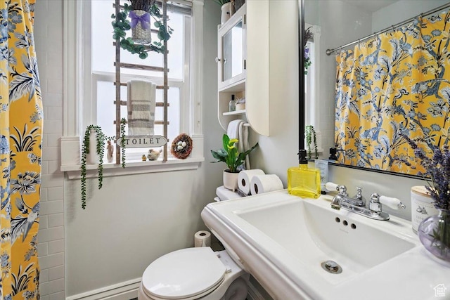 344 E Utopia Ave, South Salt Lake, UT 84115 - bathroom featuring a baseboard heating unit and a shower with shower curtain