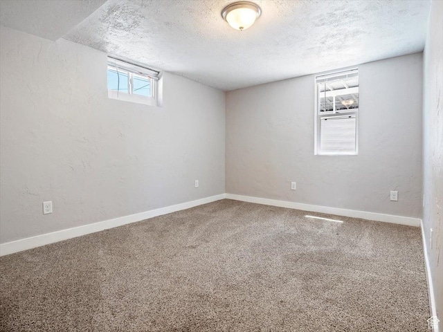 344 E Utopia Ave, South Salt Lake, UT 84115 - below grade area featuring a textured ceiling and carpet floors