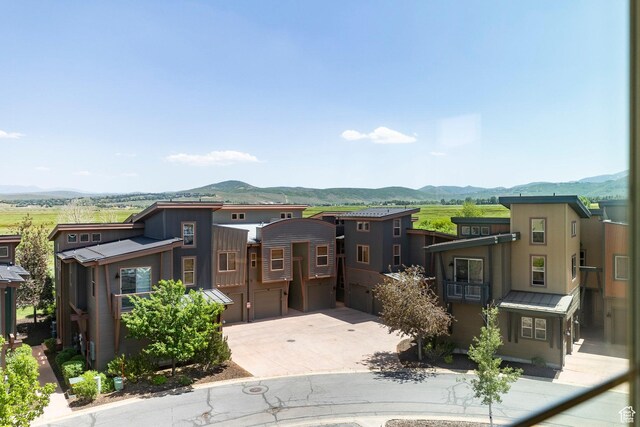 6169 Park Ln S Unit 36, Park City, UT 84098 - view of front of home featuring a mountain view, a garage, and concrete driveway