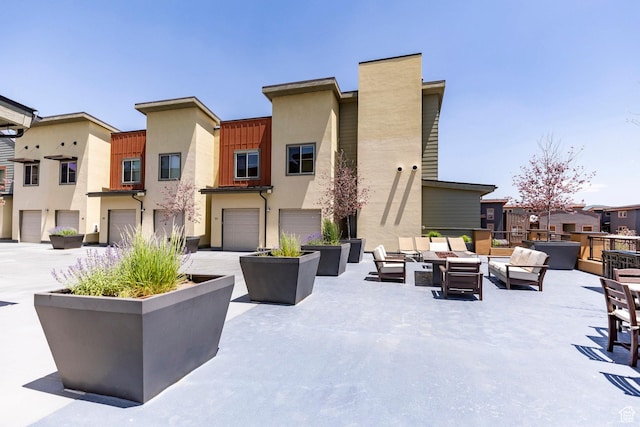 6169 Park Ln S Unit 36, Park City, UT 84098 - exterior space featuring stucco siding, outdoor lounge area, and a residential view