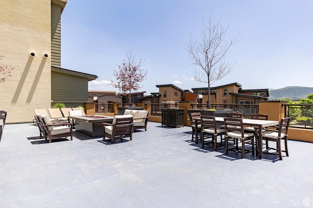 6169 Park Ln S Unit 36, Park City, UT 84098 - view of patio / terrace featuring an outdoor living space with a fire pit, outdoor dining space, and a mountain view