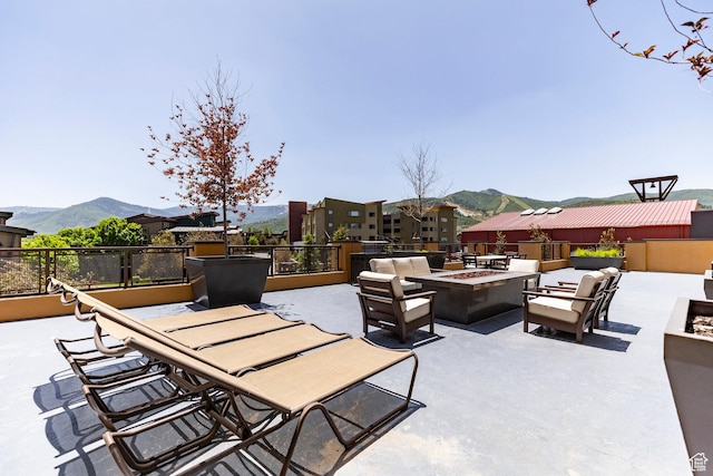 6169 Park Ln S Unit 36, Park City, UT 84098 - view of patio with an outdoor fire pit and a mountain view