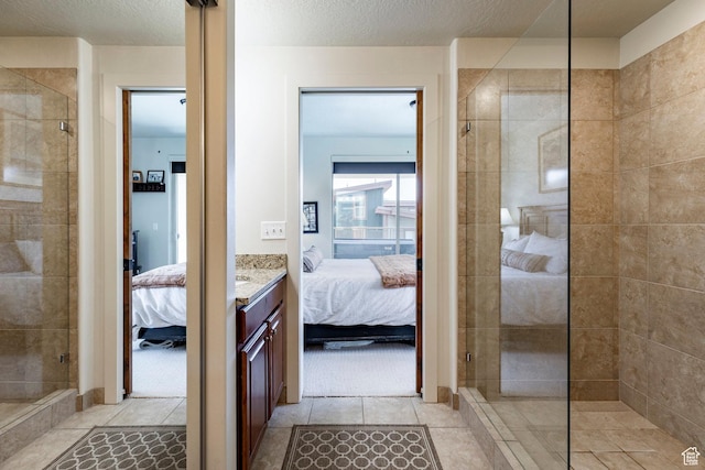 6169 Park Ln S Unit 36, Park City, UT 84098 - bathroom featuring ensuite bathroom, tiled shower, tile patterned floors, and vanity