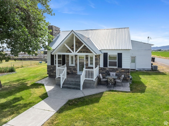 2214 S 1600 E, Preston, ID 83263 - view of front of home with stone siding, a chimney, and a metal roof
