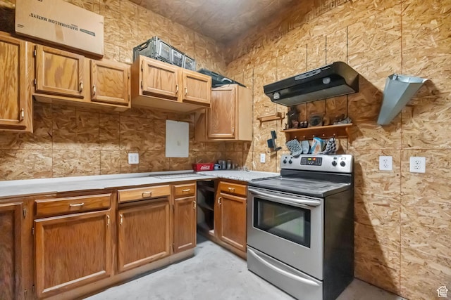 2214 S 1600 E, Preston, ID 83263 - kitchen featuring electric stove, ventilation hood, light countertops, concrete flooring, and brown cabinets