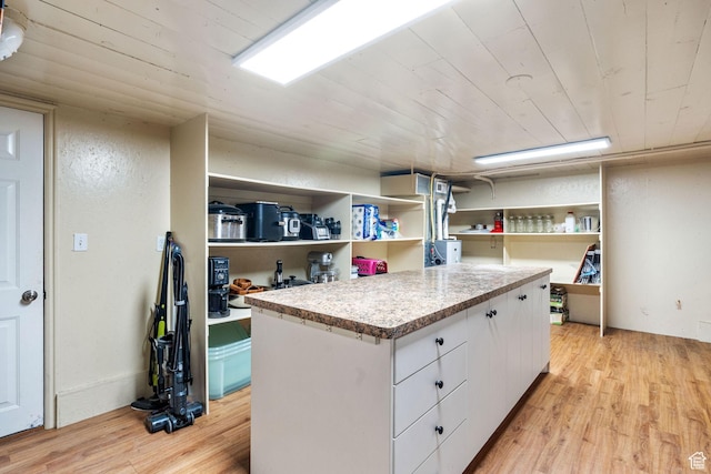 2214 S 1600 E, Preston, ID 83263 - kitchen with wood ceiling, light wood-style flooring, white cabinets, open shelves, and light countertops