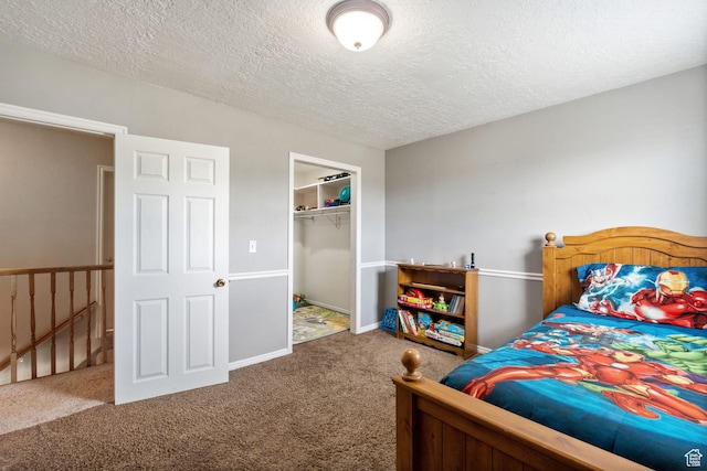 2214 S 1600 E, Preston, ID 83263 - carpeted bedroom with a textured ceiling, a walk in closet, and a closet