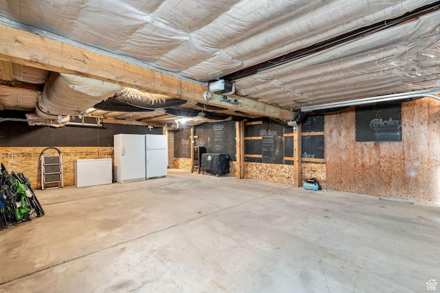 2214 S 1600 E, Preston, ID 83263 - garage with a garage door opener, fridge, and freestanding refrigerator